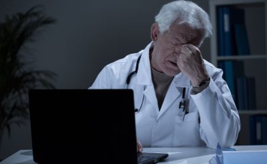 41634893 - exhausted older physician with headache after day at work